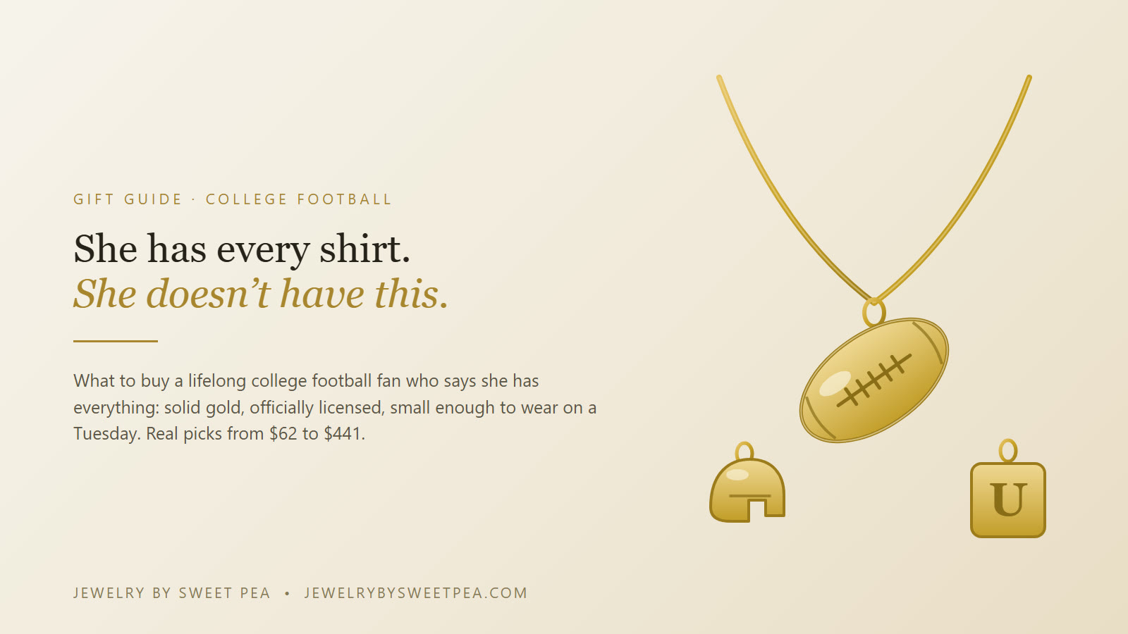 A solid gold football pendant on a fine cable chain beside a small gold college letter pendant, on cream fabric